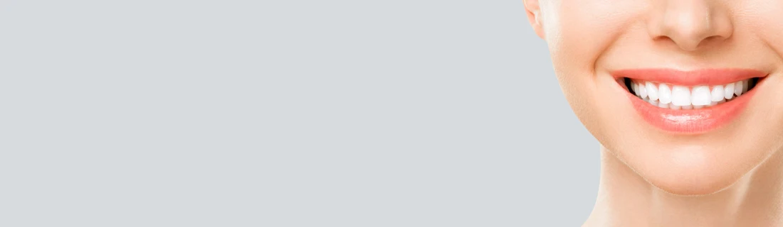 A woman with perfect teeth, smiling.